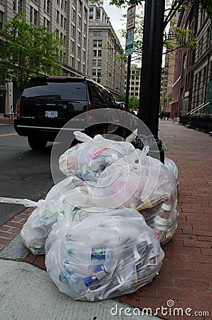 Large trash bags on the sidewalks and streets of Washington DC after an event Editorial Stock Photo
