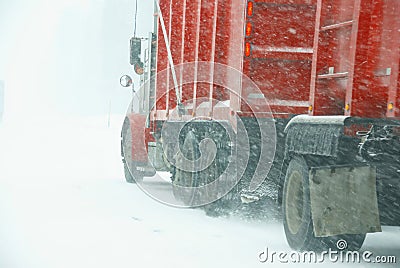 Large trucks fight a winter storm Stock Photo