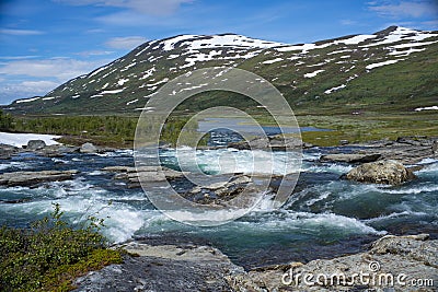 Large turquoise River landscape and mountainous valley in Padjelanta Stock Photo