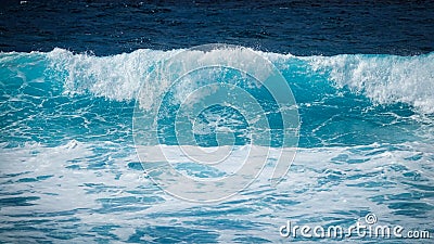 Large turquoise wave in the sea. Stock Photo