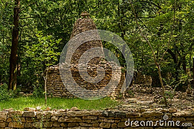 Two story cairn under shade trees Stock Photo