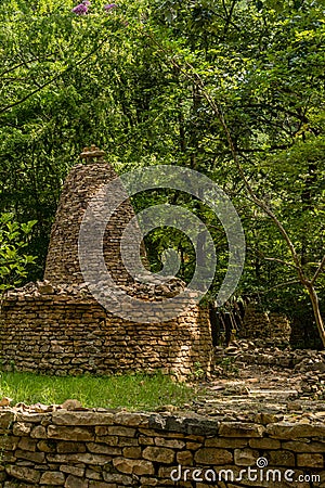 Two story cairn under shade trees Stock Photo