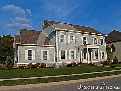 Large Two-Story Gray Home Stock Photo