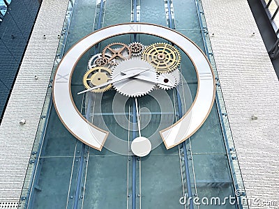 A large wall clock hangs at the entrance to the mall Stock Photo