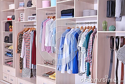 Large wardrobe with clothes and shoes Stock Photo