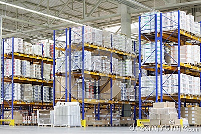 Large warehouse with lots of tall shelves Stock Photo