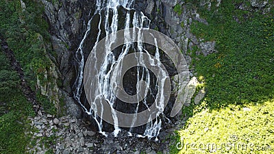 The large waterfall flowing from the mountain. Waterfall with a very high flow. Waterfall Balea. Stock Photo
