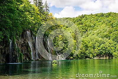 A large waterfall in the shade overlooking the rest of the natural reserve a beautiful set to contemplate. Stock Photo