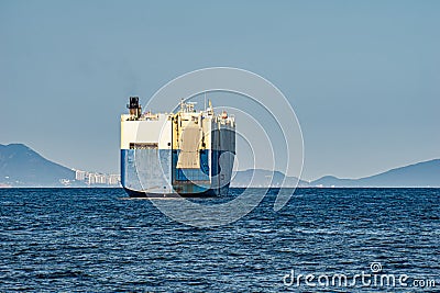 Large White and blue Roll-on/roll-off RORO or ro-ro ships or oceangoing vehicle carrier ship anchor in the open sea. Roro ship Stock Photo