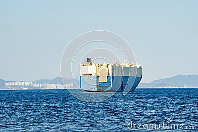 Large White and blue Roll-on/roll-off RORO or ro-ro ships or oceangoing vehicle carrier ship anchor in the open sea. Roro ship Stock Photo