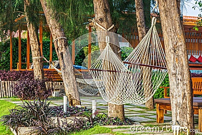 Large white polyester rope hammocks for relaxation Stock Photo