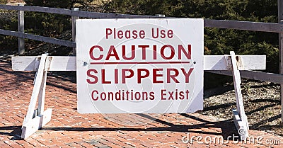 Please use caution slippery conditions exist sign Stock Photo