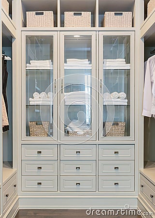 Large white walk-in closet with shelves Stock Photo