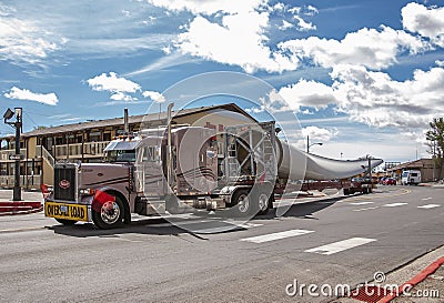 Large windmill wing transport and Jim Butler Inn, Tonopah, NV, USA Editorial Stock Photo