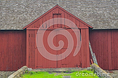 Close up of a big red barn with large double doors in Chaddsforge Pa. Stock Photo