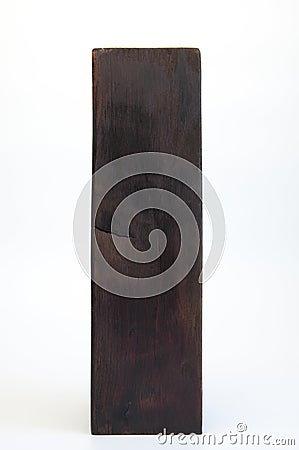 Large wooden brown block. Design column made of wood. On white background Stock Photo