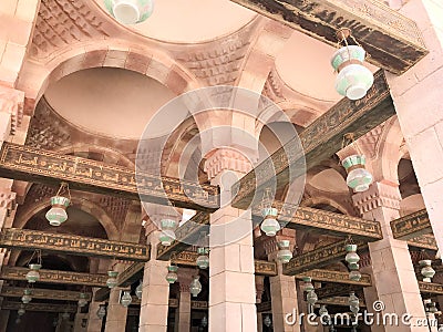 Large wooden ceiling beams, planks, ceilings under the ceiling with arches and lamps, lanterns in the Arab Islamic Mosque, a templ Stock Photo