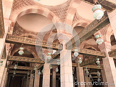 Large wooden ceiling beams, planks, ceilings under the ceiling with arches and lamps, lanterns in the Arab Islamic Mosque, a templ Stock Photo