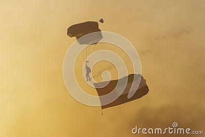 Largest Military Show at Marjan Island with coordinated military aircrafts and parachuter with a large UAE flag landing in the Editorial Stock Photo