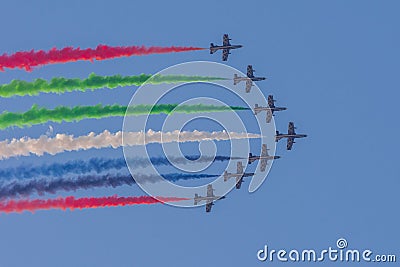 Largest Military Show at Marjan Island with coordinated military aircrafts showing the UAE flag colors on the bright blue sky Editorial Stock Photo