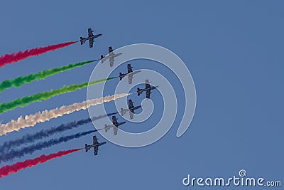 Largest Military Show at Marjan Island with coordinated military aircrafts showing the UAE flag colors on the bright blue sky Editorial Stock Photo