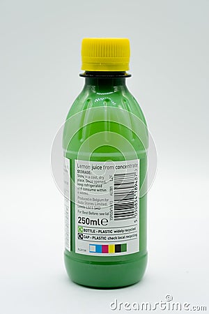 Bottle of Asda Branded lemon Juice in a recyclable Plastic Bottle and Cap Editorial Stock Photo