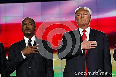 LAS VEGAS - DECEMBER 15: Republican presidential candidates Donald J. Trump and Ben Carson hold hand over heart at CNN republican Editorial Stock Photo