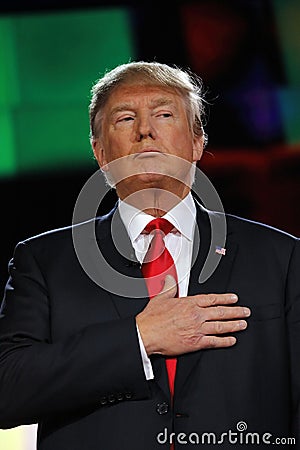 LAS VEGAS, NV - DECEMBER 15: Republican presidential frontrunner Donald J. Trump holds hand over heart at CNN republican president Editorial Stock Photo