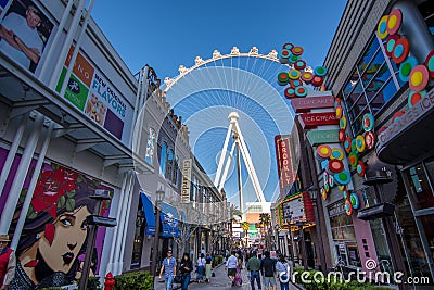Las Vegas, US - April 27, 2018: Tourtists visting the LInq promenade and High roller in Las Vegas as seen on a sunny day Editorial Stock Photo