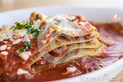 Lasagna. Tasty dish. Red sauce. Blurred Background Stock Photo