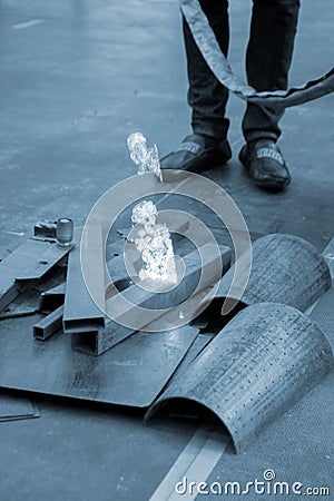 Laser cleaning of metal. The laser beam cleans the metal surface from rust. Stock Photo