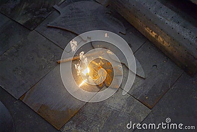 Laser cleaning of metal. The laser beam cleans the metal surface from rust. Stock Photo