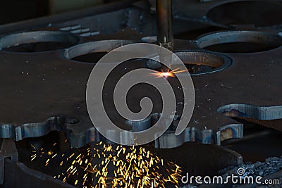 Laser cutting welding flat sheet metal steel material with spark Stock Photo