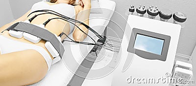 Laser lipo equipment. Cosmetic fat reduce treatment. Woman in medicine salon. Anti cellulite procedure Stock Photo