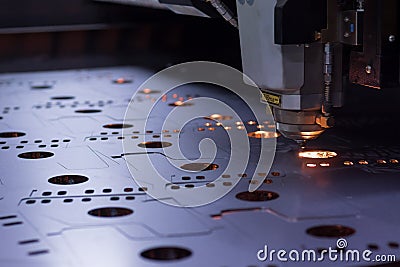 Laser machine cutting of sheet metal. Stock Photo