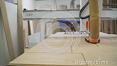 Woodworking CNC machine in a furniture factory. Machine for cutting MDF. Furniture manufacturing process. Laser machine for the Stock Photo