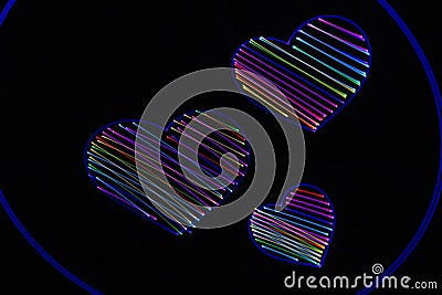 Laser multicolored hearts on black Stock Photo