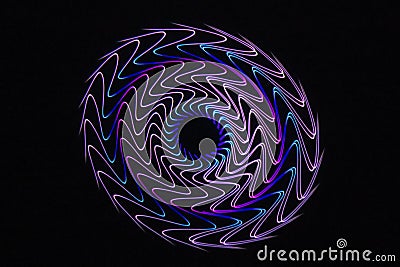 Laser multicolored wavy line circular mandala on black Stock Photo