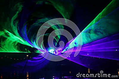 Laser show during public free event on public street and water with small ships parad Editorial Stock Photo