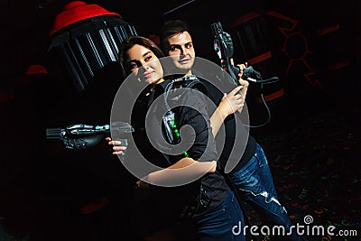 Laser tag girl and guy Stock Photo