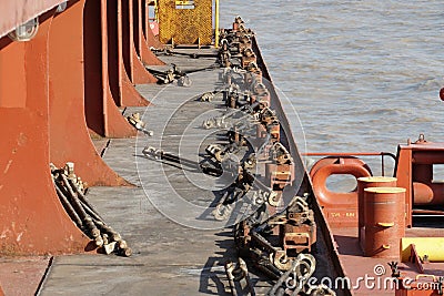 Lashing material, bottom twist-locks and turnbuckles for securing containers on the container vessel to secure containers, Stock Photo