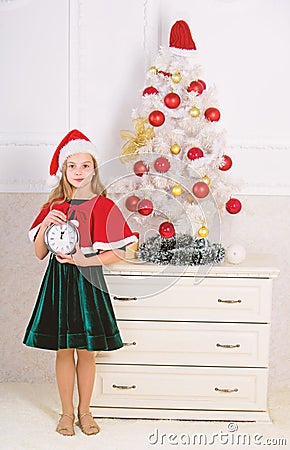 Last minute till midnight. Last minute new years eve plan. Merry christmas concept. New year countdown. Girl kid santa Stock Photo