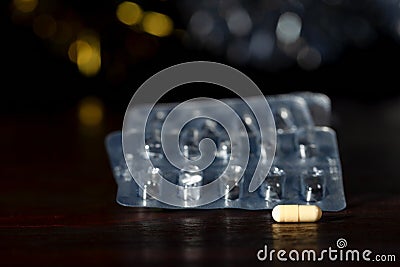 The last pill in front of the empty blister packs Stock Photo