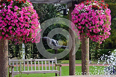 Statue surrounded by pink and white flowers Editorial Stock Photo