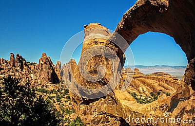 Late Afternoon sunlight on sandstone fin Arch, Arches National Park, Utah Stock Photo