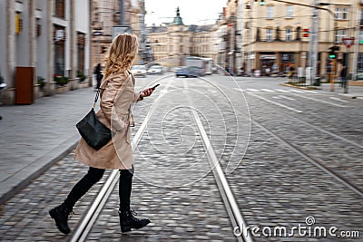 Late again to work. Panning shot of rushing woman running at street Stock Photo