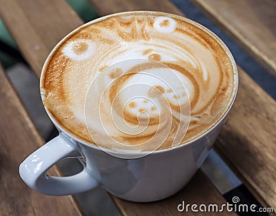 Late Art made in coffee shop, beautiful happy bear on table Stock Photo