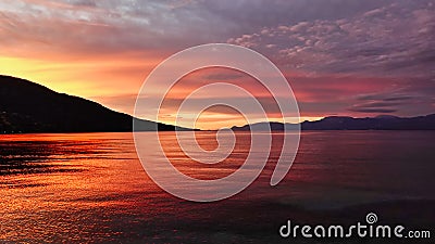 Dawn and Emerging Sunrise, Dramatic Light on Gulf of Corinth Bay, Greece Stock Photo