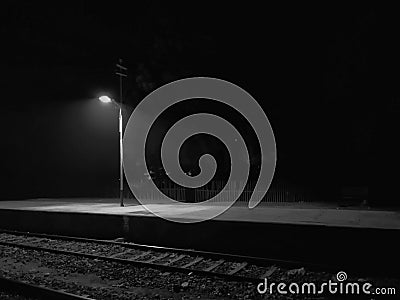 Late night railway junction station lights and platforms Stock Photo