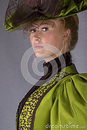 Late Victorian woman in green silk ensemble Stock Photo